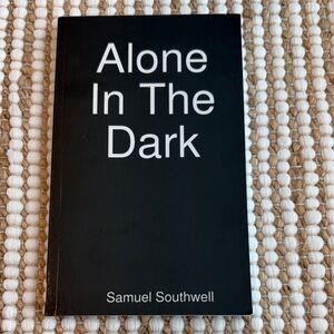 Black 'Alone In The Dark' Book by Samuel Southwell